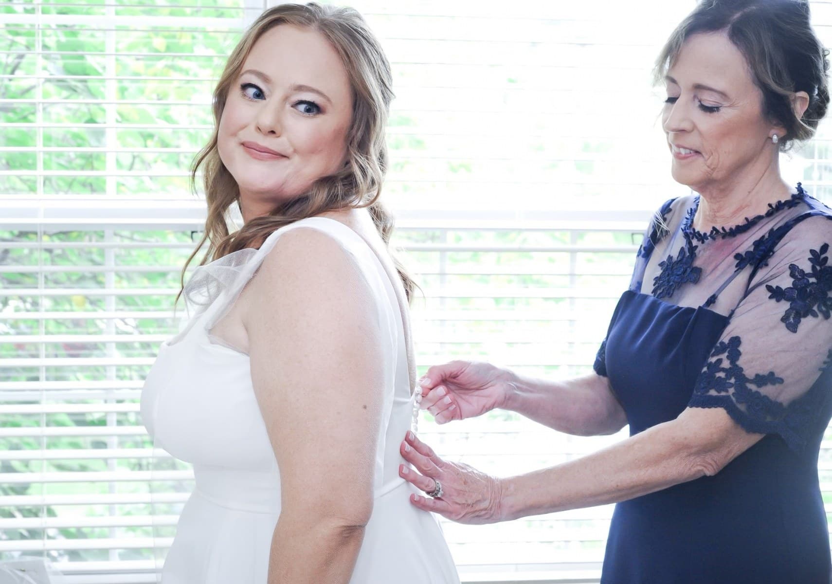 Christina getting ready in her custom Nicole Pink gown