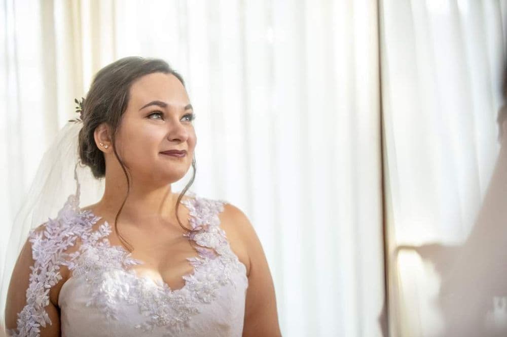 Gabby in her custom gown and veil in the Colorado mountains