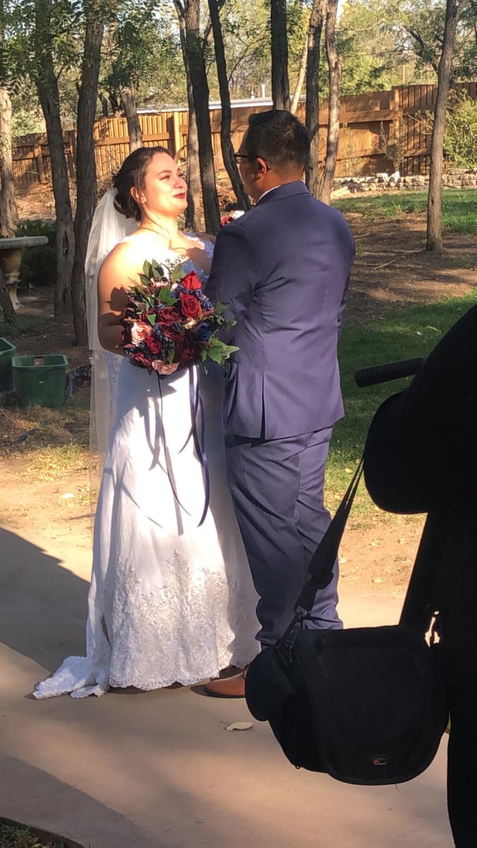 Gabby celebrating in her custom Nicole Pink wedding look